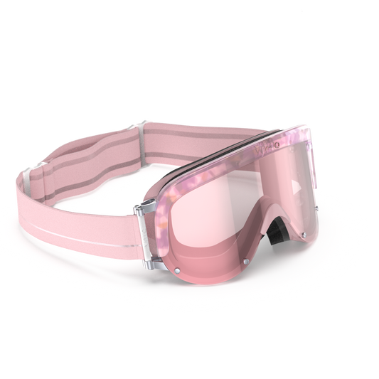 Pink goggles with clear lenses on a white background